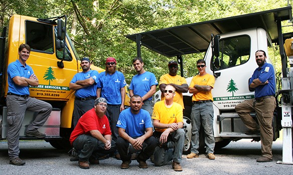 Group photo of loggers with equipment
